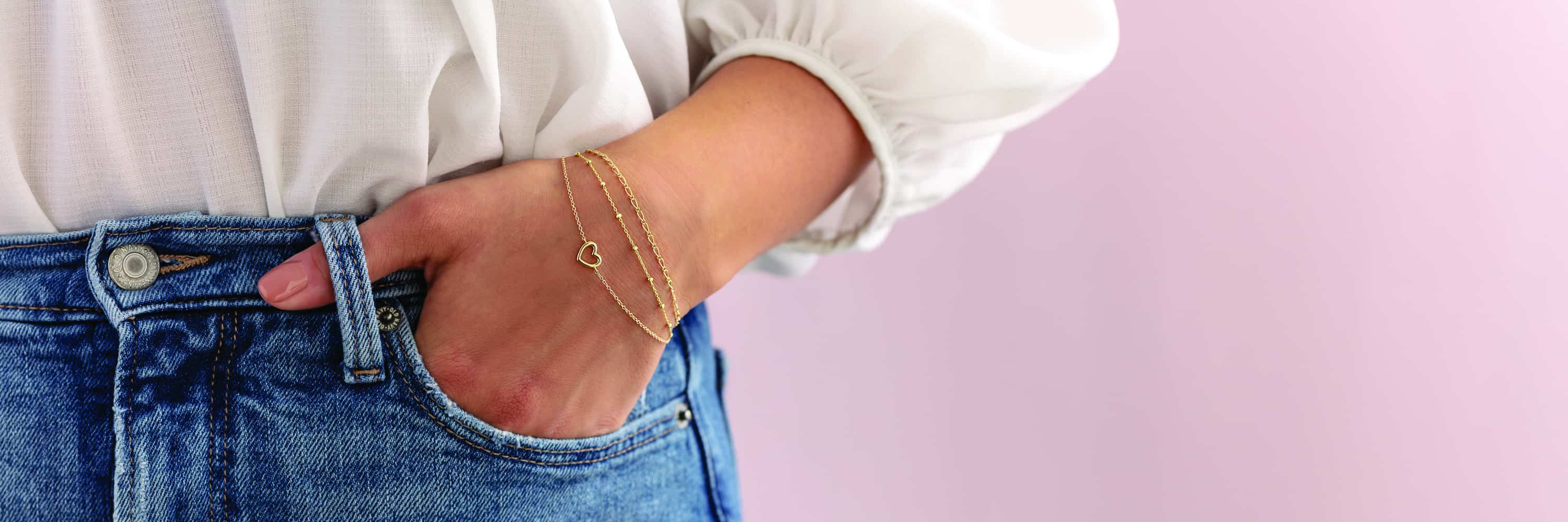 fine bracelets on woman's wrist